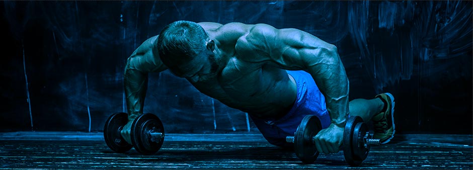 Muscular bodybuilder guy over dark background